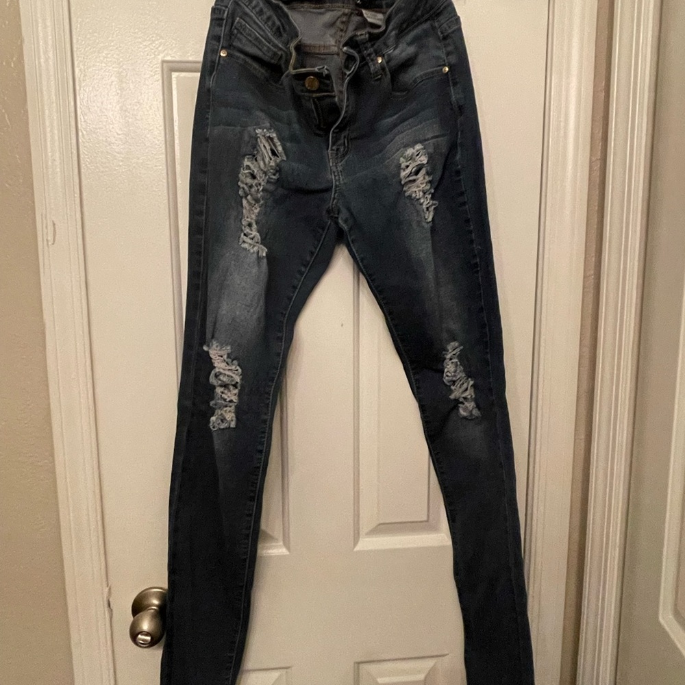 Distressed cut out jeans